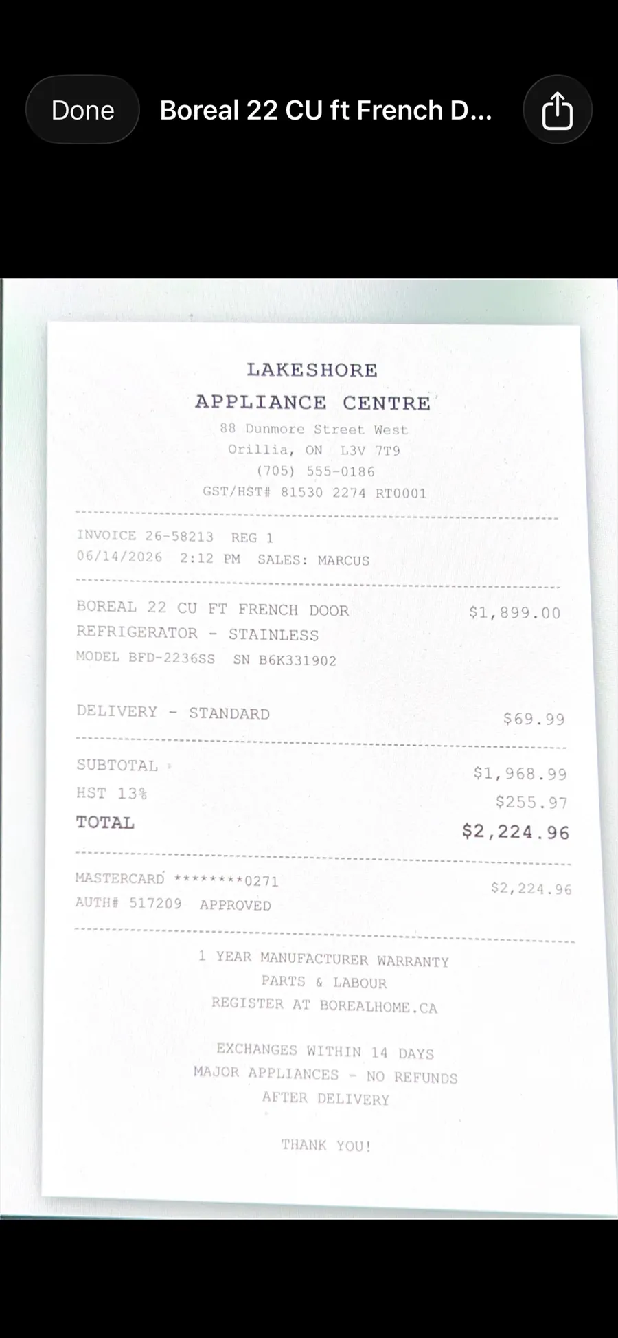 Full screen receipt photo viewer showing a scanned store receipt.